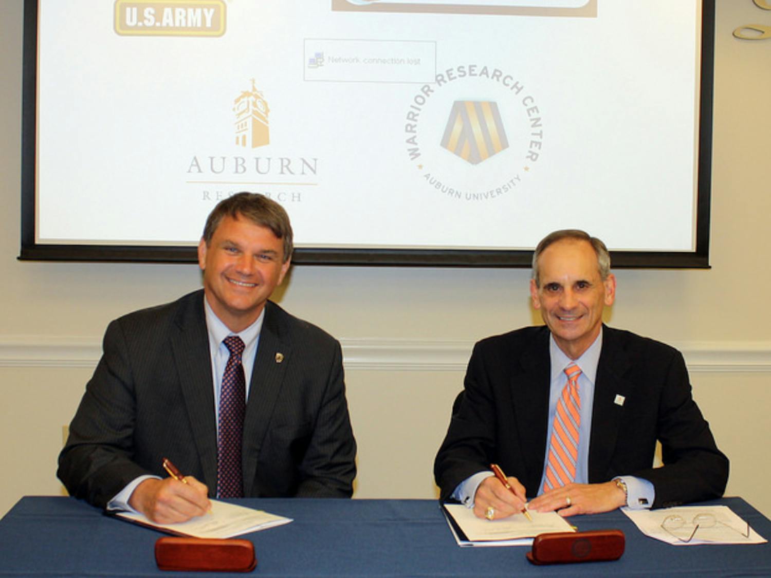 Jeff Langhout , left, acting technical director of the U.S. Army’s Aviation and Missile Research, with John Mason, Auburn’s vice president for research and economic development