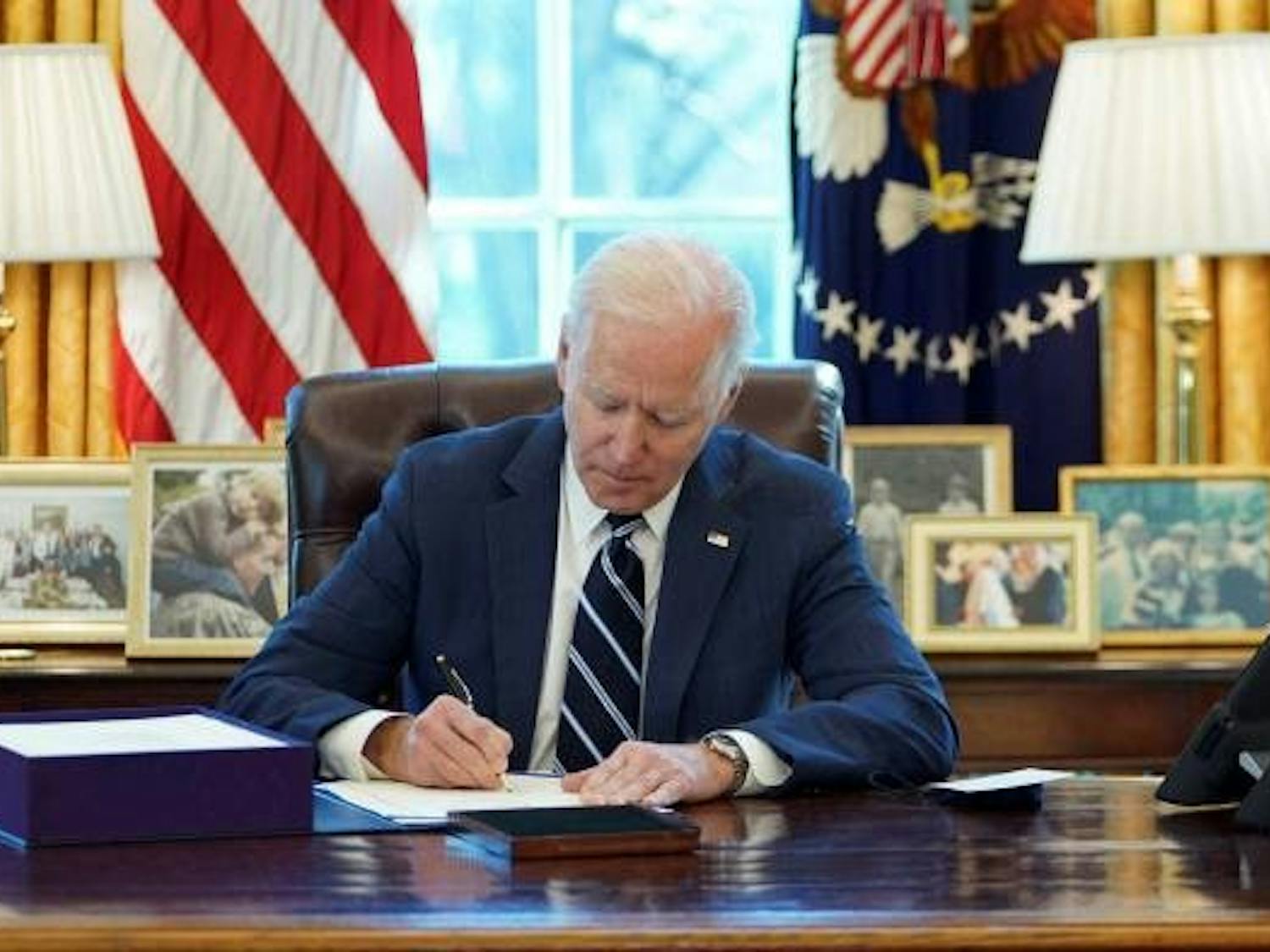 Joe Biden Signing Bill.jpg
