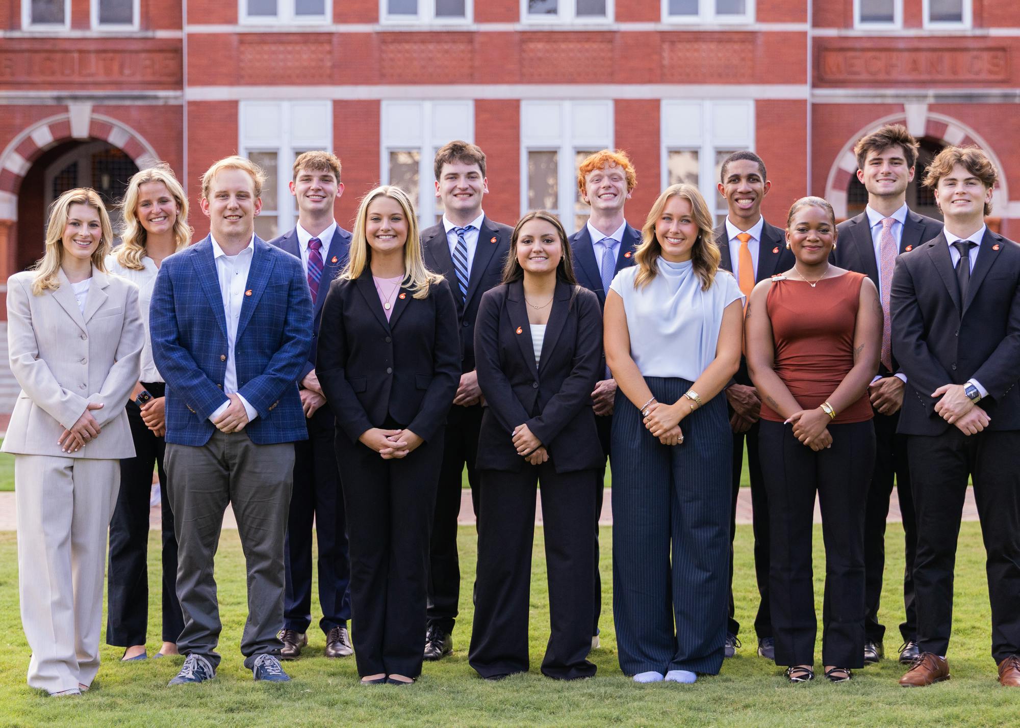Eagle Eye TV staff pose for a group photo on the lawn in front of Samford Hall at Auburn University, dressed in professional attire. People from left to right in this picture are: Vivian Kennell, Hampton Lane, Lucy Chapman, Madison Seidel, Allison Thomas, Courtenee Webster, Graham Bower. In the second row, it is Barrett Brown, Chaz Kapfhammer, Jonny Koeninger, Lucas Hazelrig, Jalen Walker, Gavin Dimit