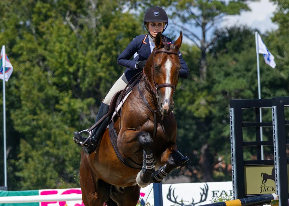 Auburn equestrian rider Avery Glynn competes on horseback during a jumping event at the Auburn University Equestrian Center.