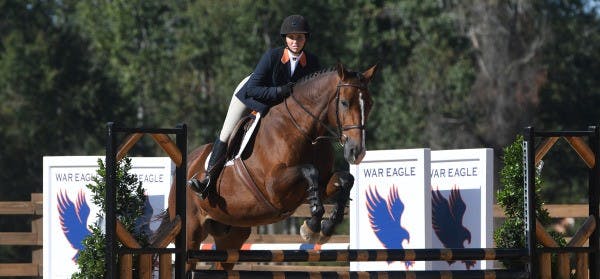 Auburn rider jumps over fence