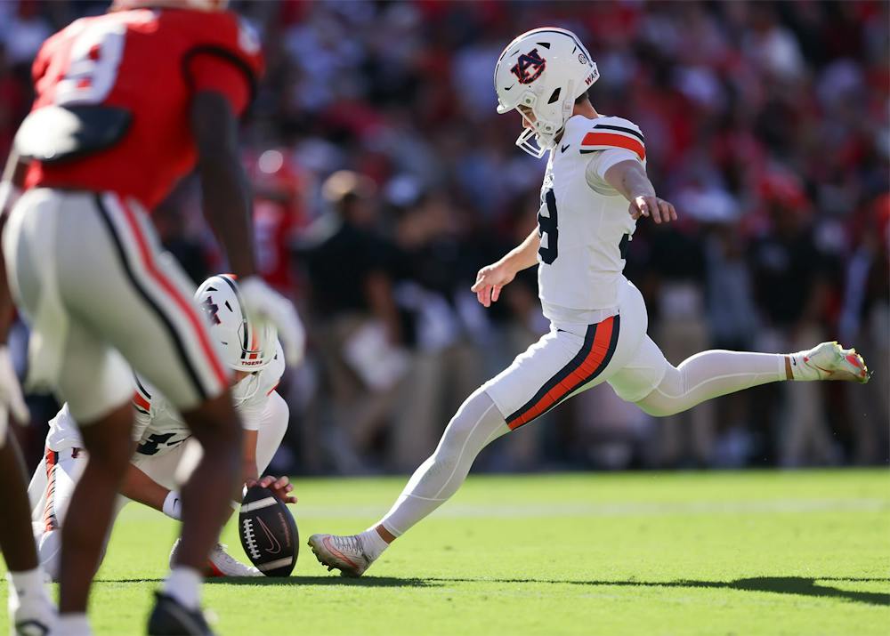 Auburn kicker Alex McPherson kicks the football during a game against Georgia at Sanford Stadium.