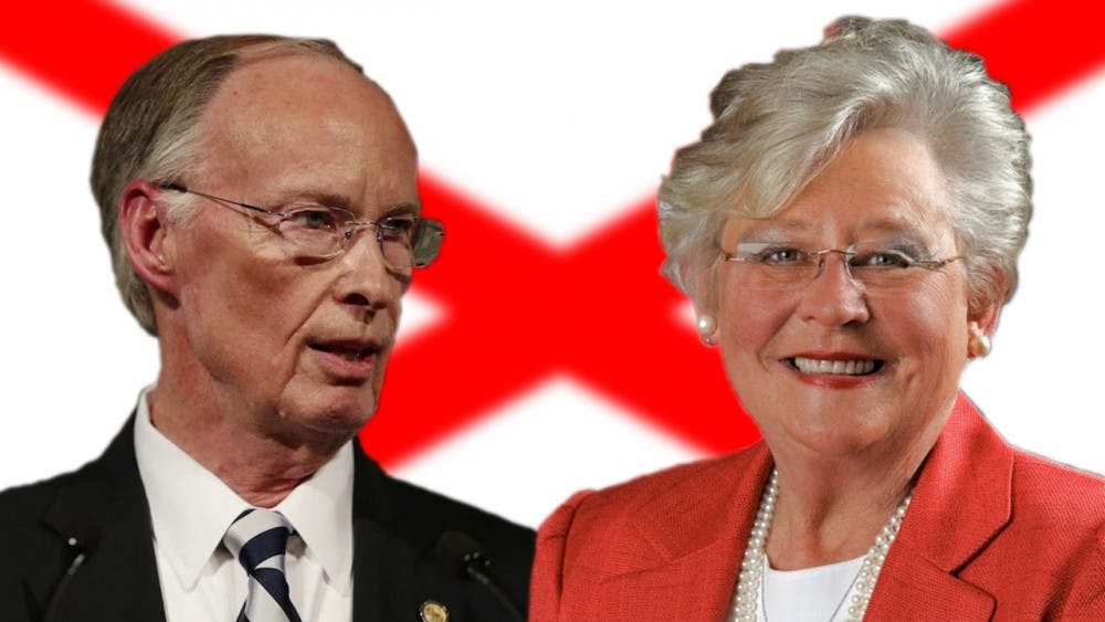 Robert Bentley and Kay Ivey in front of Alabama flag