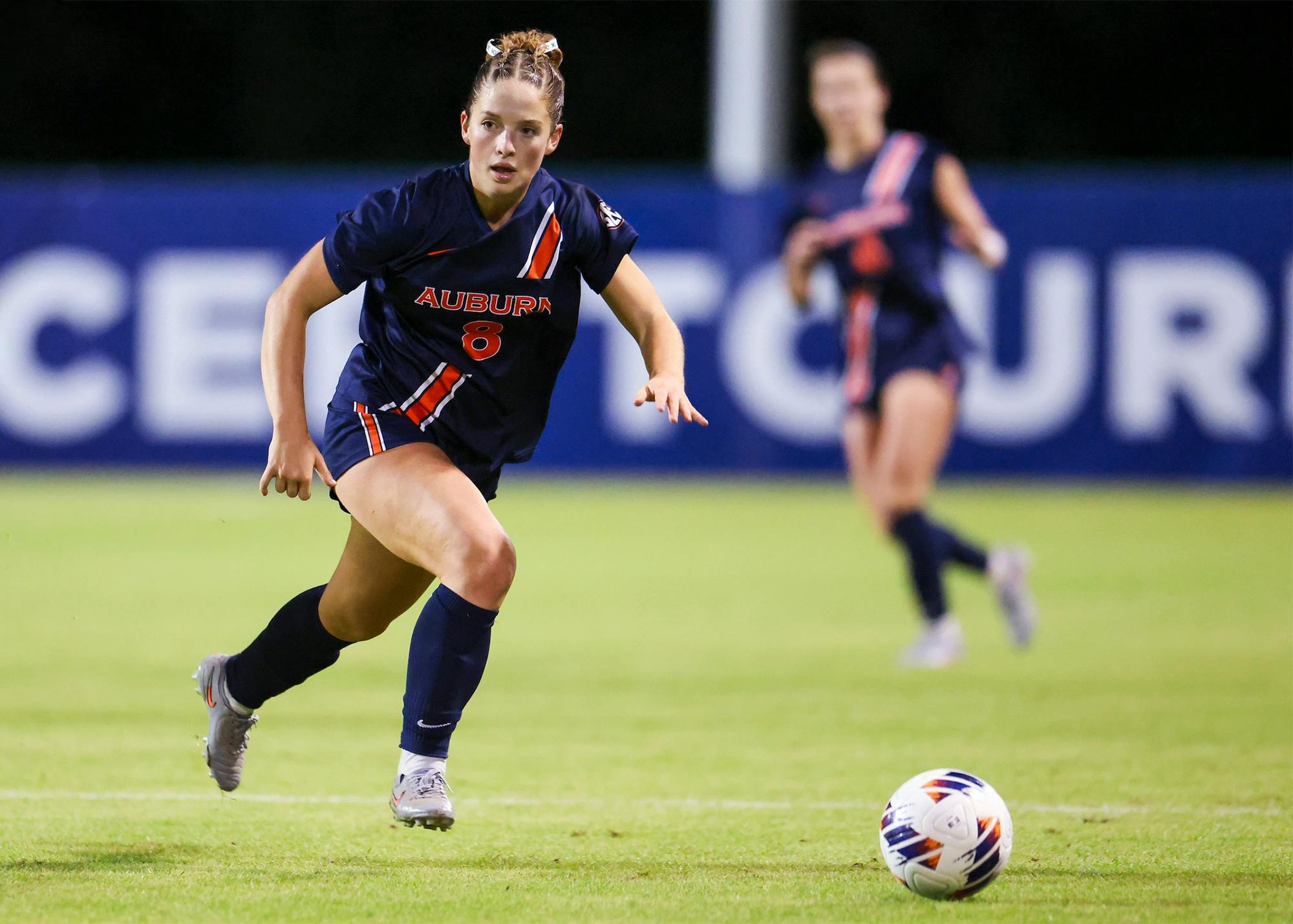 Auburn soccer player Gracie Brown dribbles the ball up the field during a match.