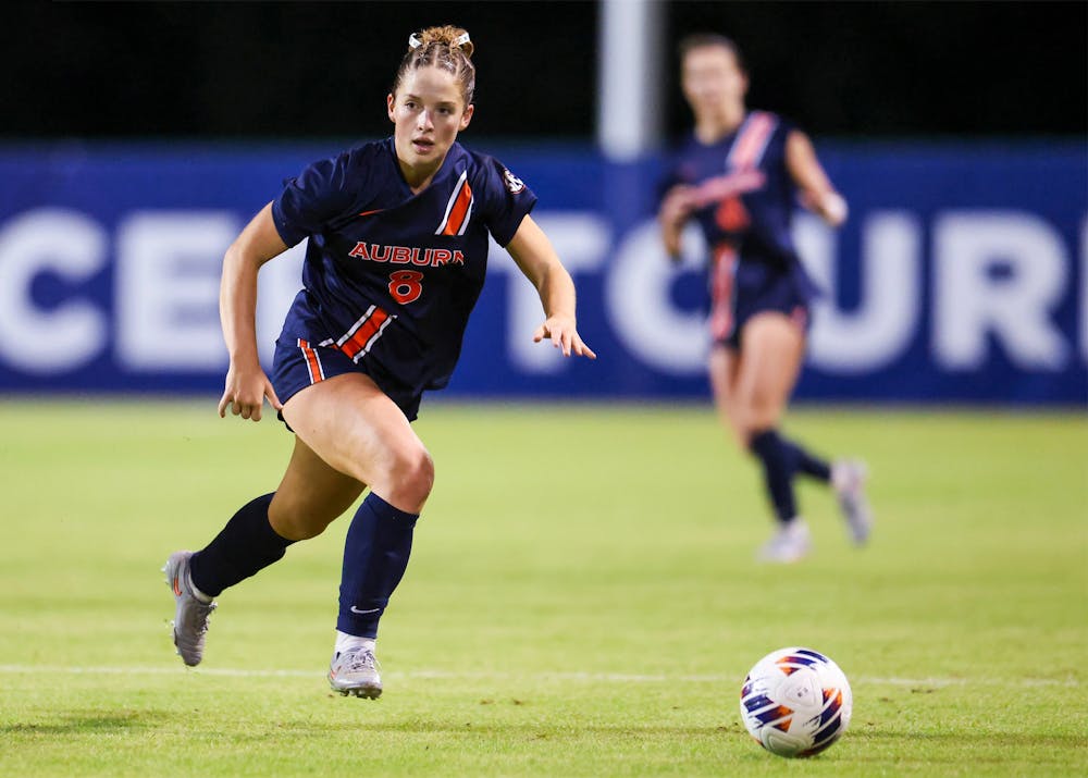 Auburn soccer player Gracie Brown dribbles the ball up the field during a match.