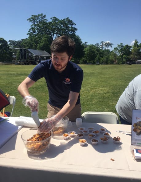 Adam Porter of Food Sciences serves trail mix.