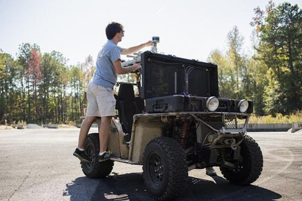 Worker working on a self driving car