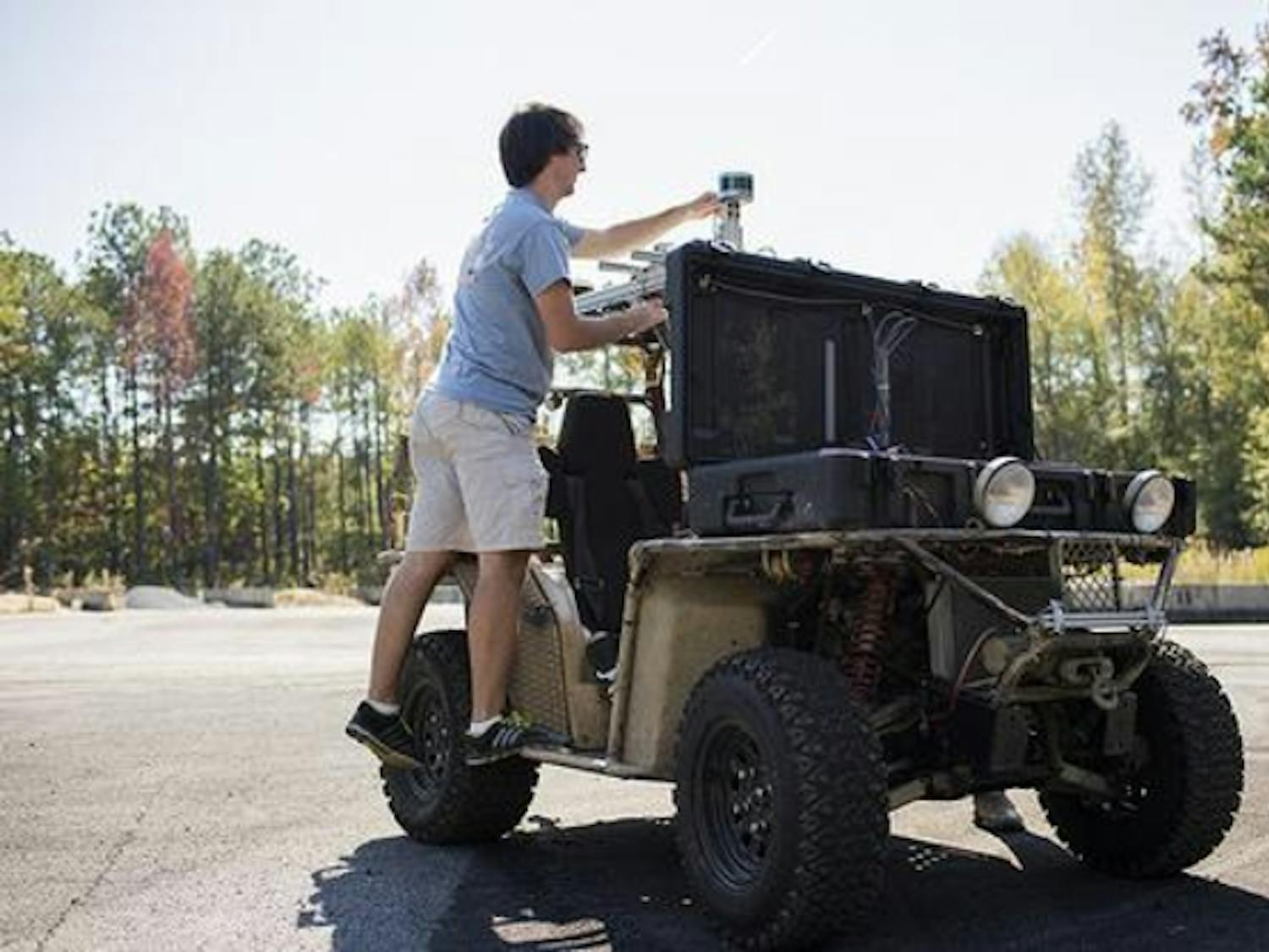 Worker working on a self driving car