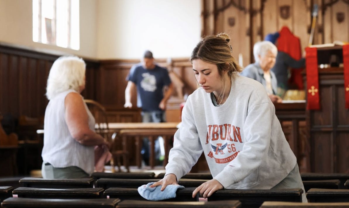 Auburn student cleaning in a local church for community service event