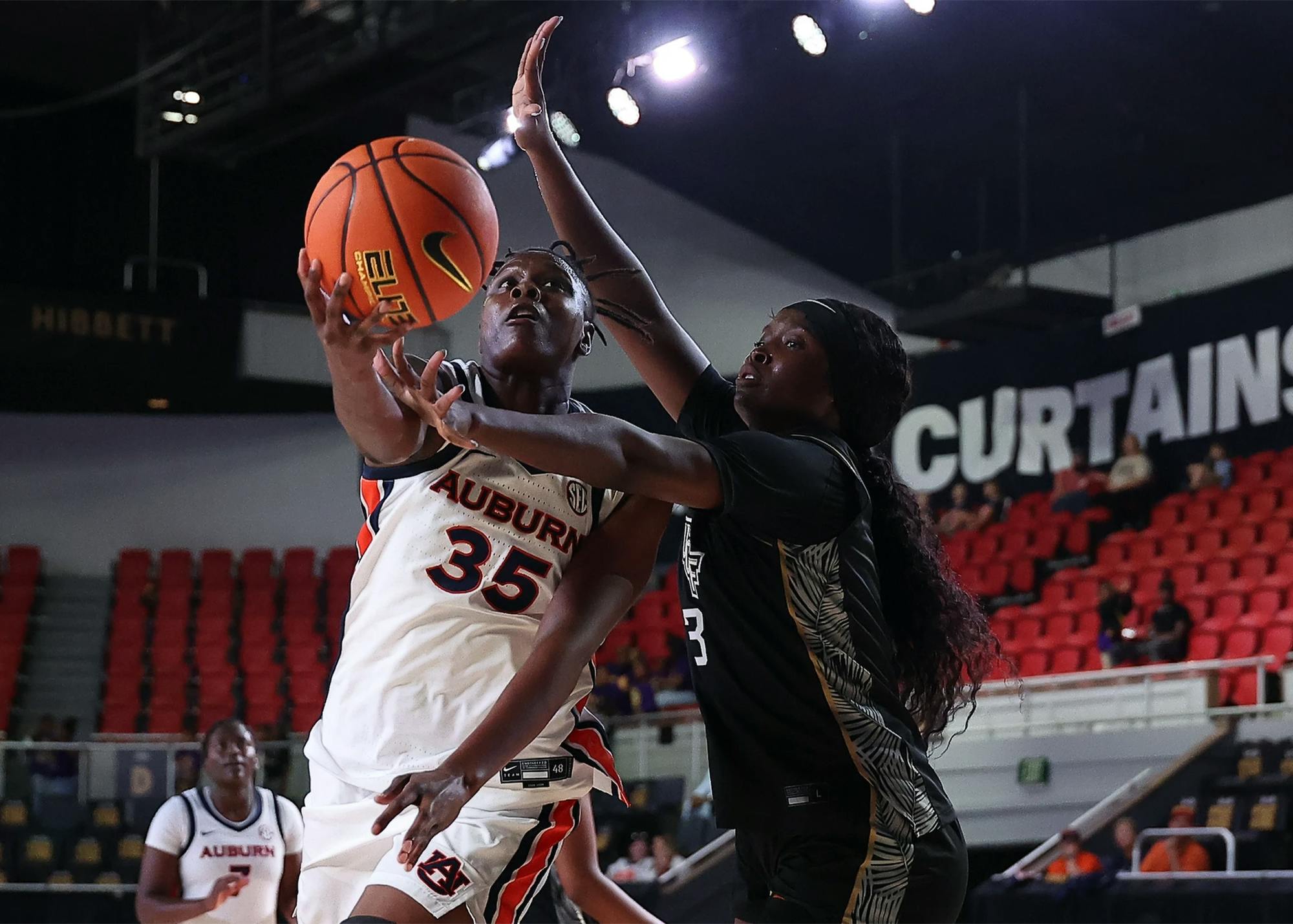 Auburn forward Quanirah Montague shoots over a Florida State defender during an exhibition game.