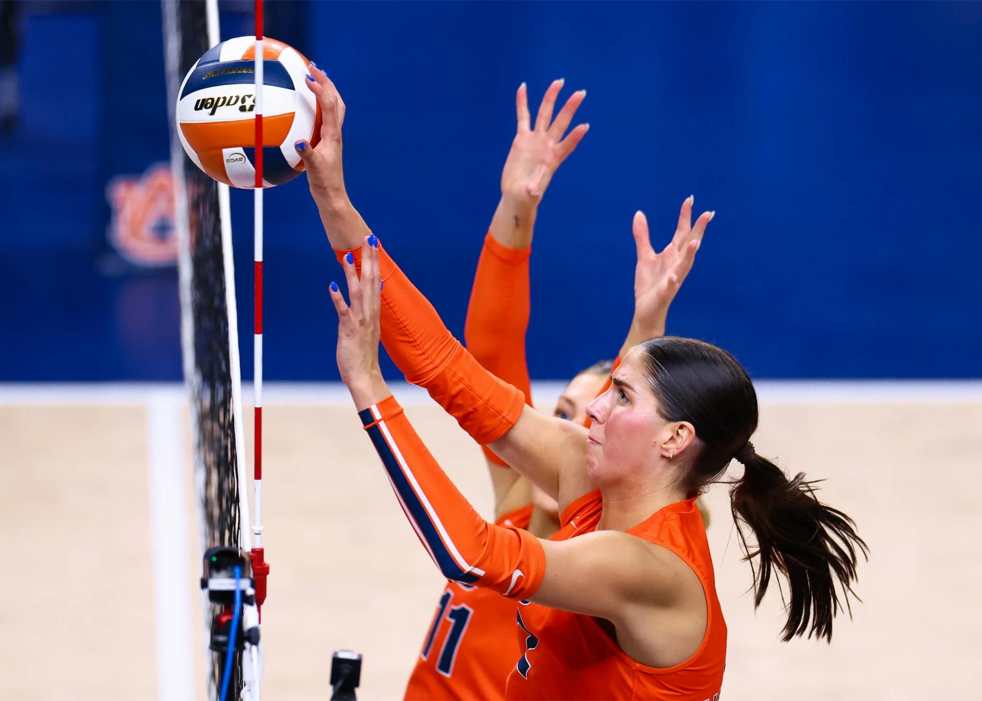 Auburn outside hitter Lauren Dreves (No. 2) reaches for the ball at the net.