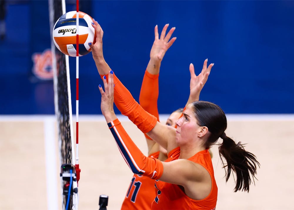 Auburn outside hitter Lauren Dreves (No. 2) reaches for the ball at the net.
