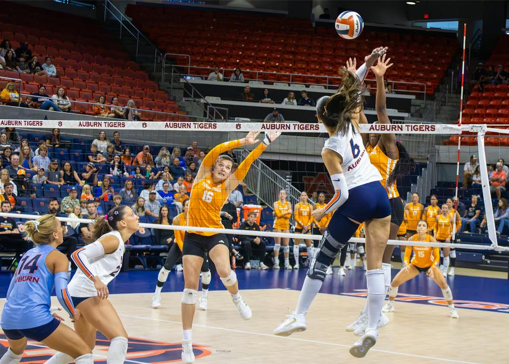 Auburn volleyball’s Anastasija Ivkovic jumps at the net to attack the ball against Tennessee at Neville Arena.