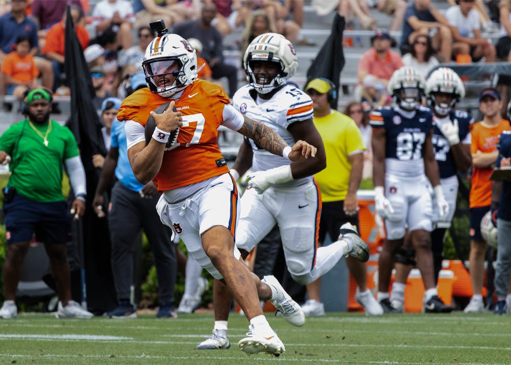 Auburn football quarterback Byrum Brown runs with the ball during A-Day game.