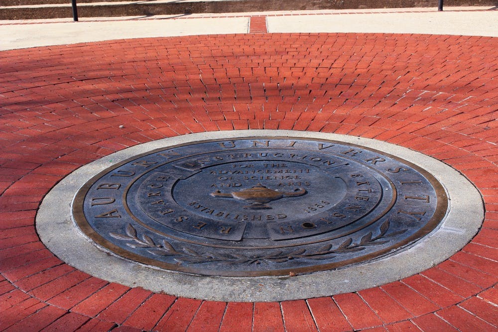 Auburn University seal in front of Langdon Hall