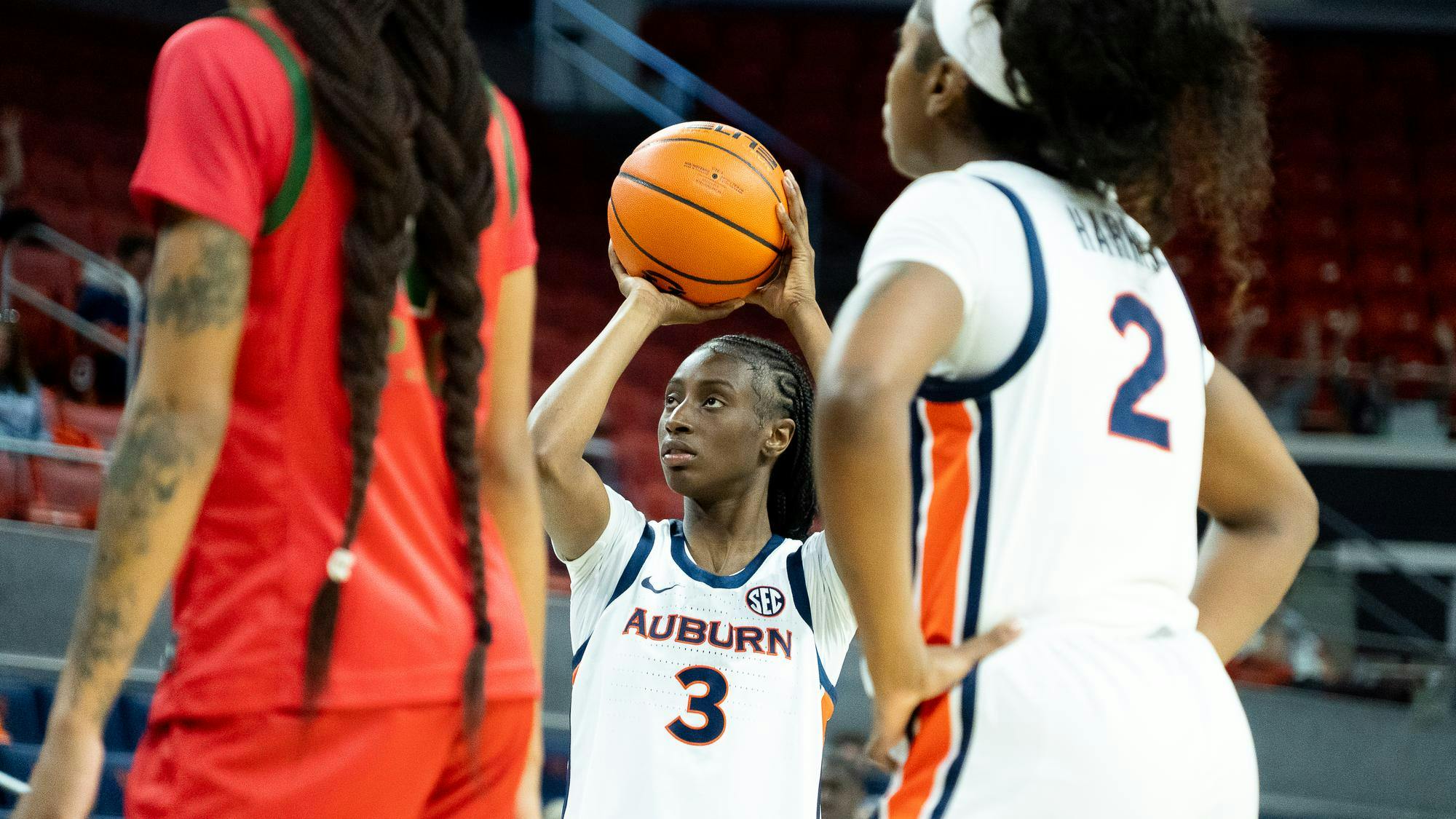 Harissoum Coulibaly (3) shoots the ball in an NCAA women's college basketball game. (Photo by Graham Bower)