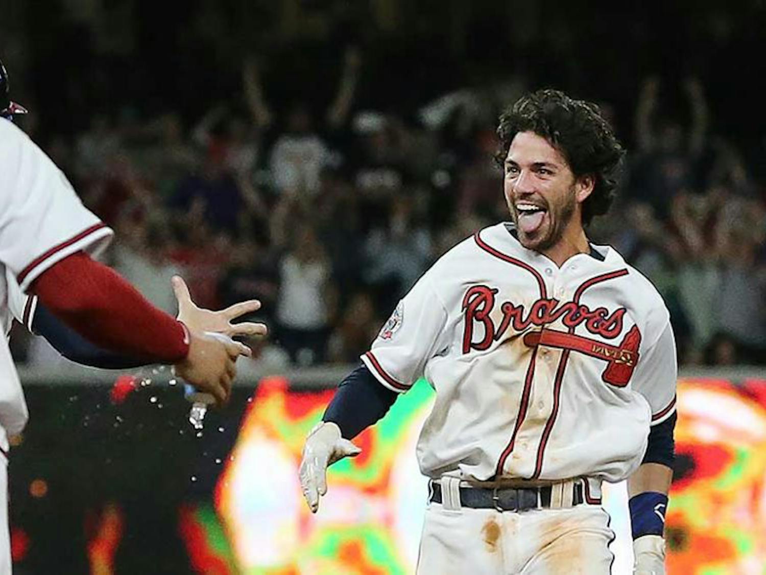 Dansby Swanson celebrating after his walk-off single.​ Photo via AJC.com.