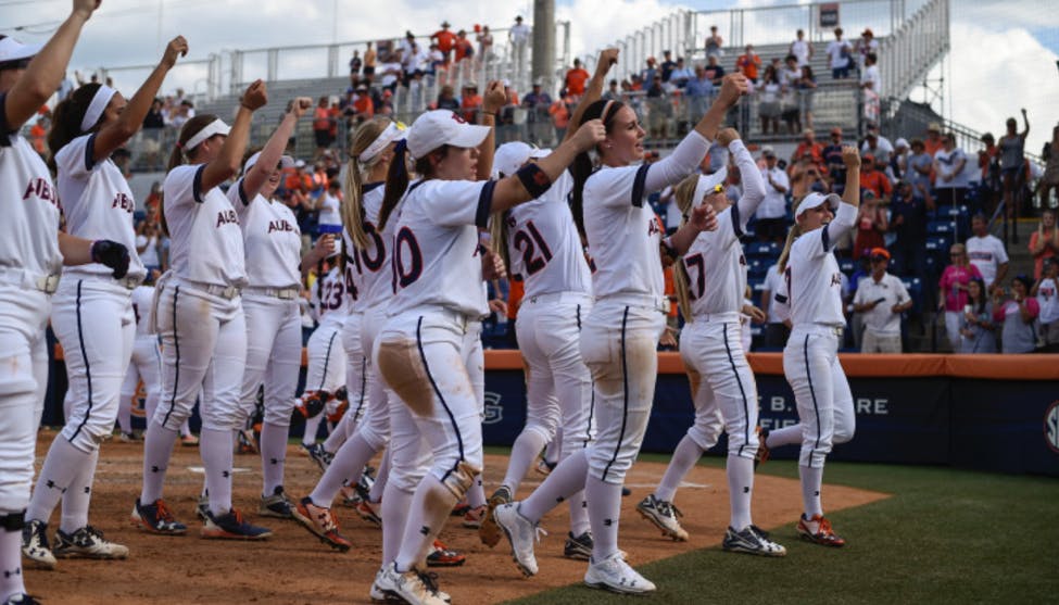 Softball team celebrating its win over Missouri. Via AuburnTigers.com​