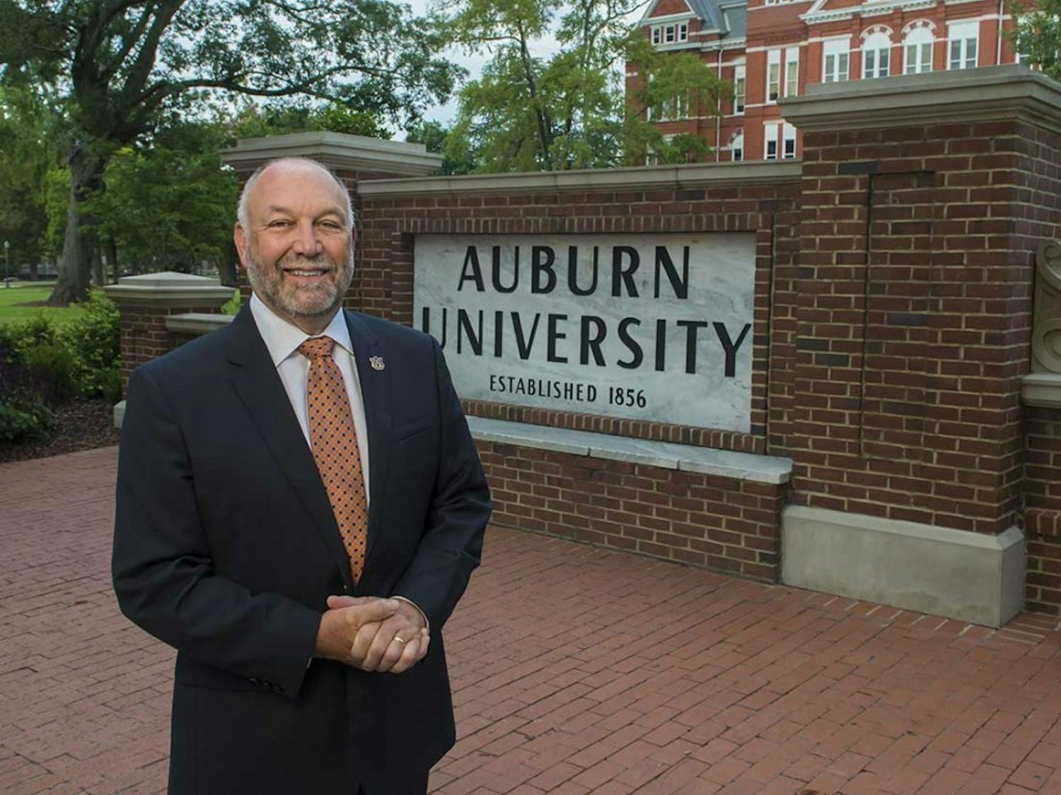 Dr. Leath in front of the Auburn University sign