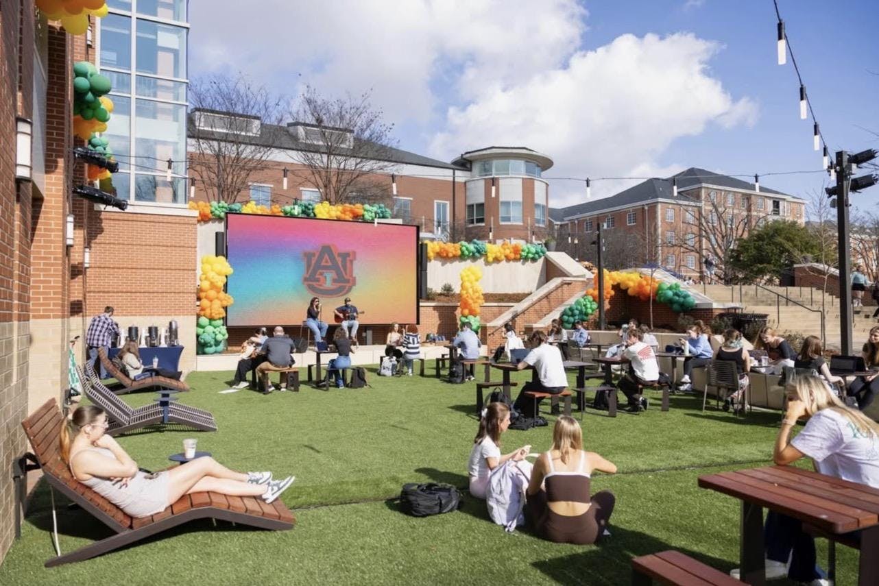 Students sitting out at the new Student Center patio