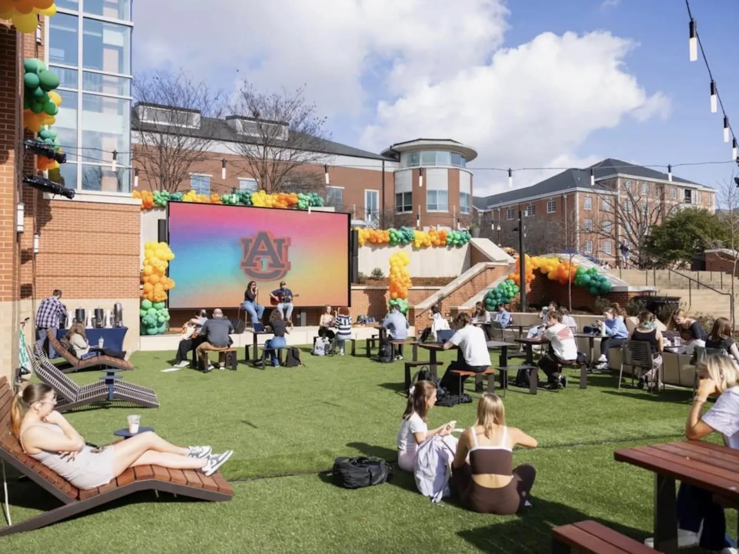 Students sitting out at the new Student Center patio