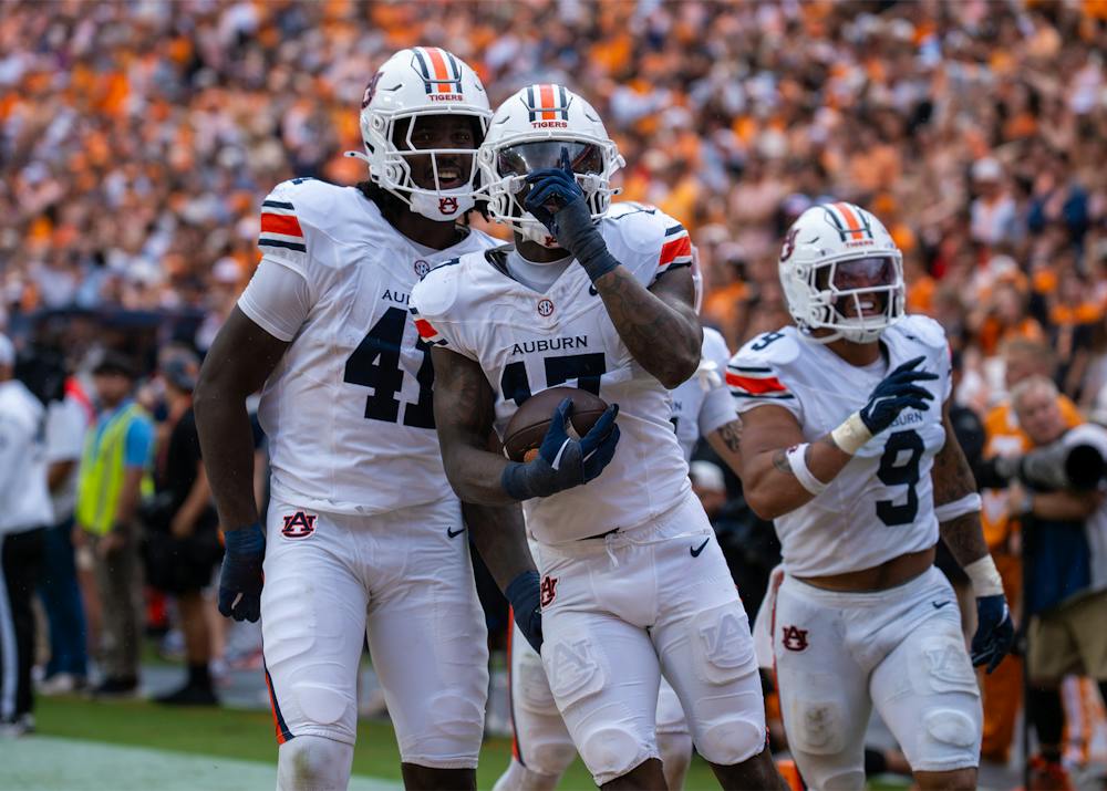 Xavier Atkins celebrates after intercepting a pass during Auburn’s game against Tennessee.