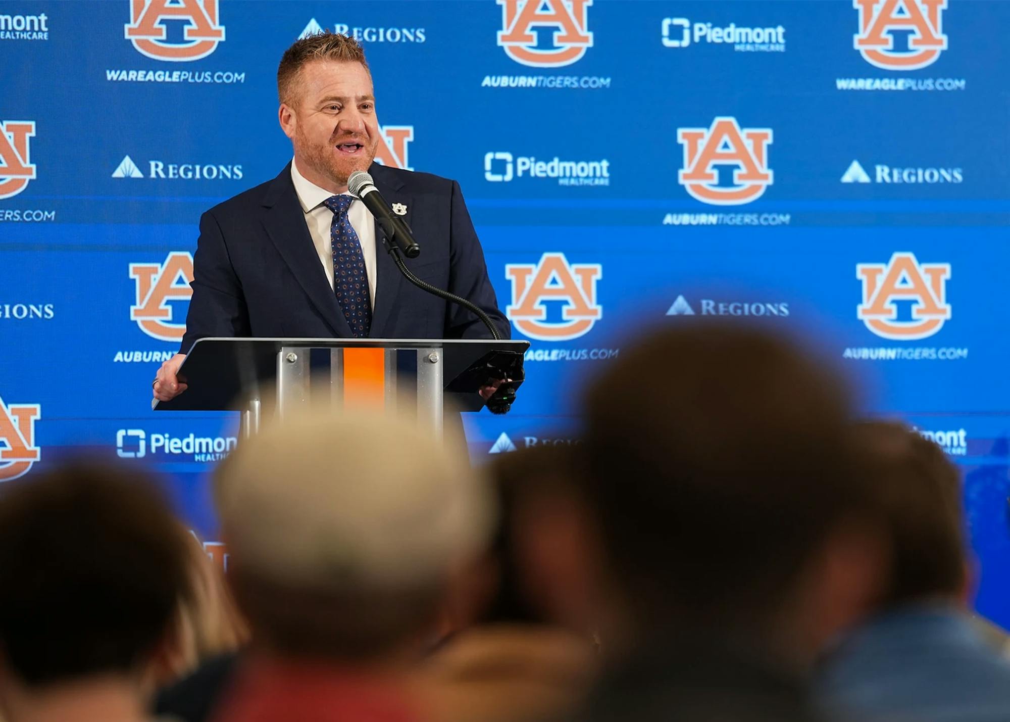 Auburn football coach Alex Golesh speaks at a press conference.