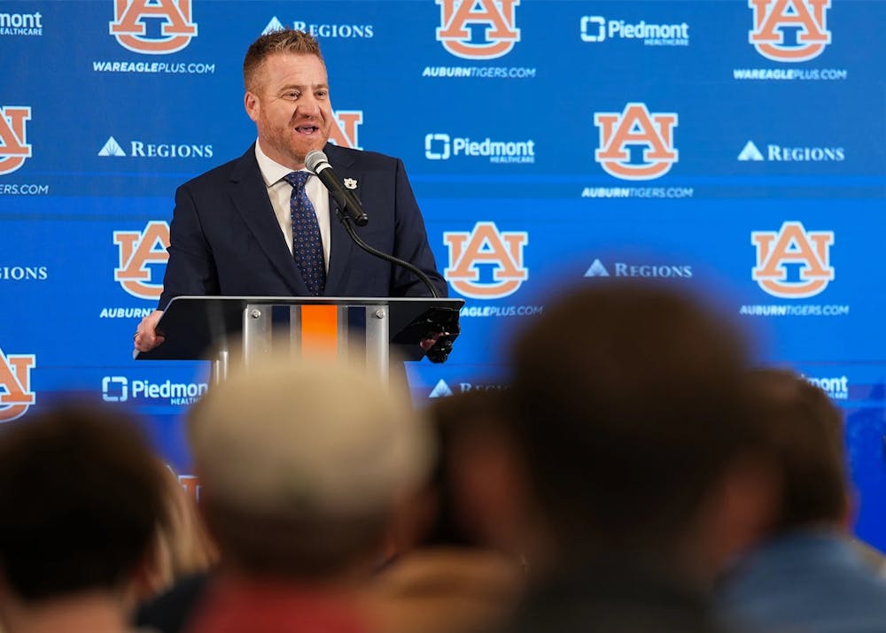 Auburn football coach Alex Golesh speaks at a press conference.