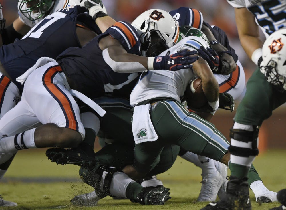 Big Kat Bryant and Marlon Davidson tackle QU Amare Jones.
Auburn Football Tulane at Auburn on Saturday, Sept. 7, 2019 in Auburn, Ala. 
