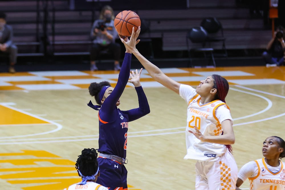 Feb 28, 2021; Knoxville, Tennessee, USA; Tennessee Lady Vols center Tamari Key (20) blocks a shot from Auburn Tigers forward Unique Thompson (20) during the first half at Thompson-Boling Arena. Mandatory Credit: Randy Sartin-USA TODAY Sports
