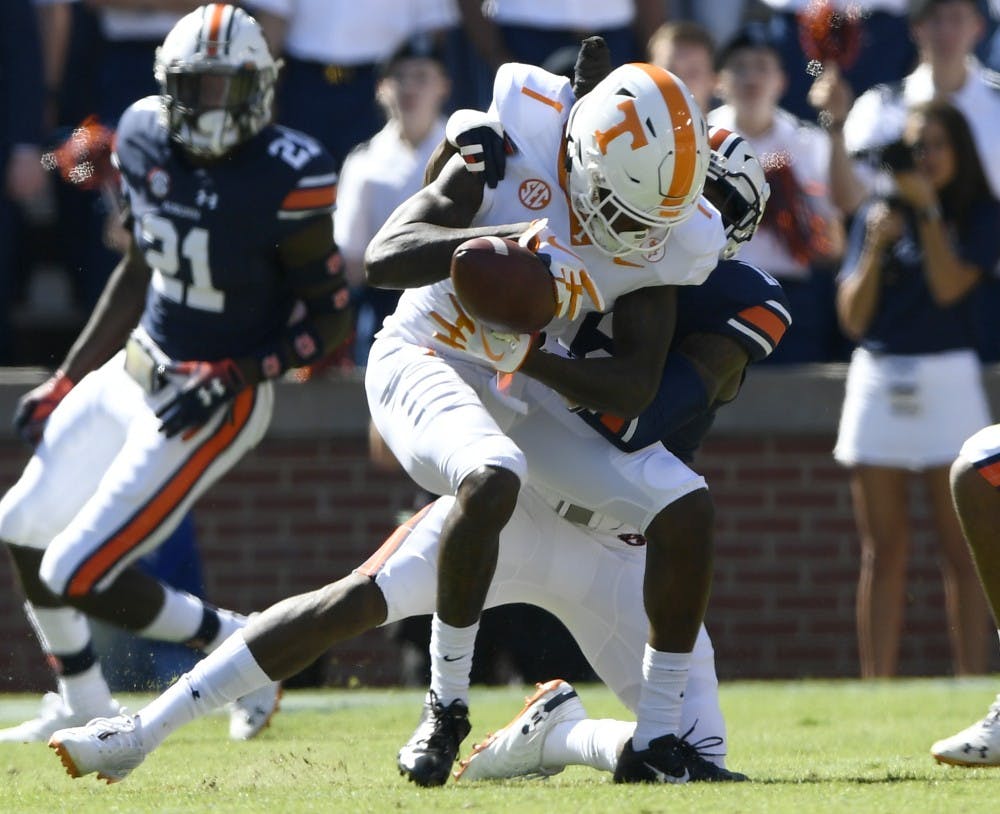 Auburn's Jamel Dean knocks the ball from Tennessee receiver Marquez Callaway in the first half.Tennessee at Auburn on Saturday, Oct. 13, 2018 in Auburn, Ala.Todd Van Emst/AU Athletics 