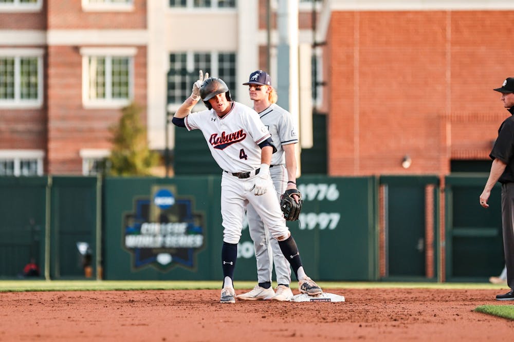 April 12, 2022; Auburn, AL, USA; Brody Moore (4) reacts after getting to second during the game between Auburn and Samford at Plainsman Park. Mandatory Credit: Jacob Taylor/AU Athletics