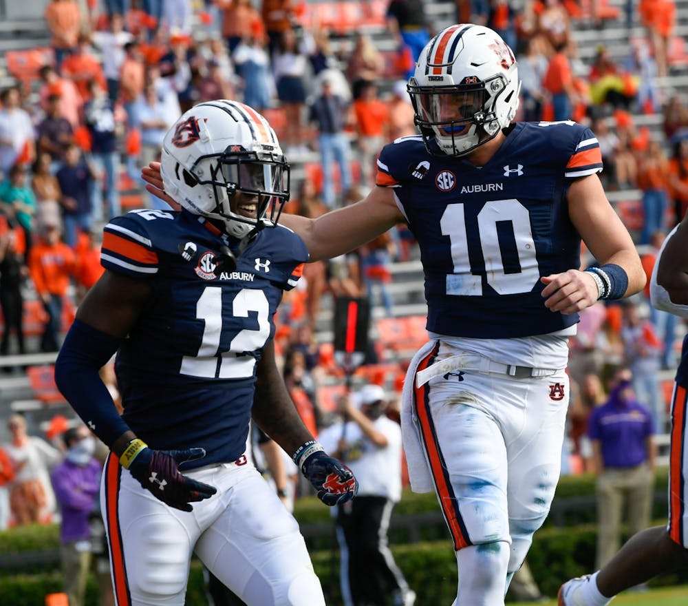 Oct 3, 2020; Auburn AL, USA; Bo Nix (10) celebrates with Eli Stove (12) after the touchdown during the game between Auburn and LSU at Jordan Hare Stadium. Mandatory Credit: Todd Van Emst/AU Athletics