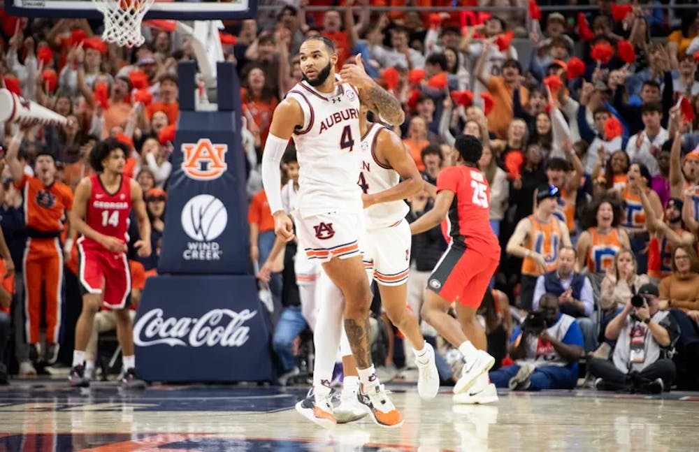 Auburn Tigers forward Johni Broome (4) celebrates a three-pointer as Auburn Tigers take on Georgia Bulldogs at Neville Arena in Auburn, Ala., on Saturday, Feb. 22, 2025. Auburn Tigers lead Georgia Bulldogs 29-24 at halftime.
Jake Crandall/ Advertiser