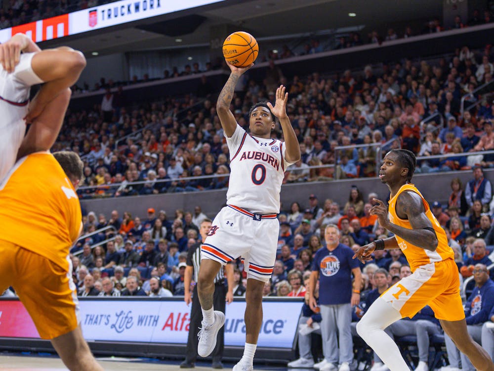 Tahaad Pettiford attempts a mid-range floater that would fall late in the second half of Auburn vs Tennessee on Jan. 25, 2024. Photo by Luca Flores | The Auburn Plainsman