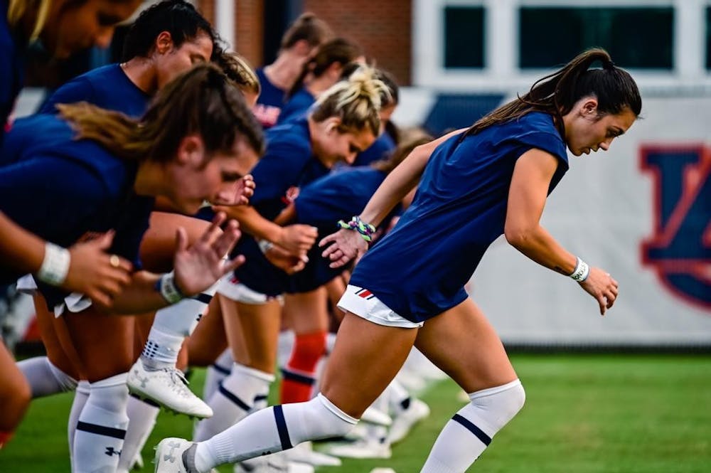 Sep 8, 2022; Auburn, Al, USA; Sydney Richards (14) sprints out of the line for wam ups before the game between Auburn and UMass Lowell at Auburn Soccer Complex.  Grayson Belanger/AU Athletics