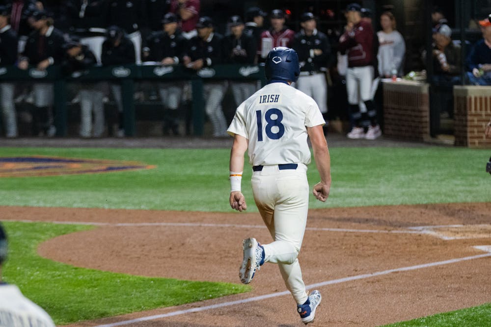 <p>Auburn Catcher/Outfielder Ike Irish comes home to score against Troy. Photo by Gracie Murray | The Auburn Plainsman</p>