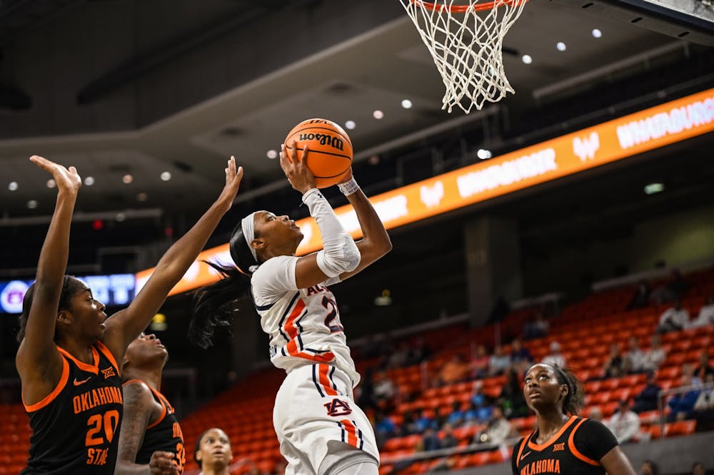 <p>Dec 5, 2021; Auburn, AL, USA; Honesty Scott-Grayson (23) goes up for a last second lay up during the game between Auburn and Oklahoma State at Auburn Arena. Mandatory Credit: Grayson Belanger/AU Athletics</p>