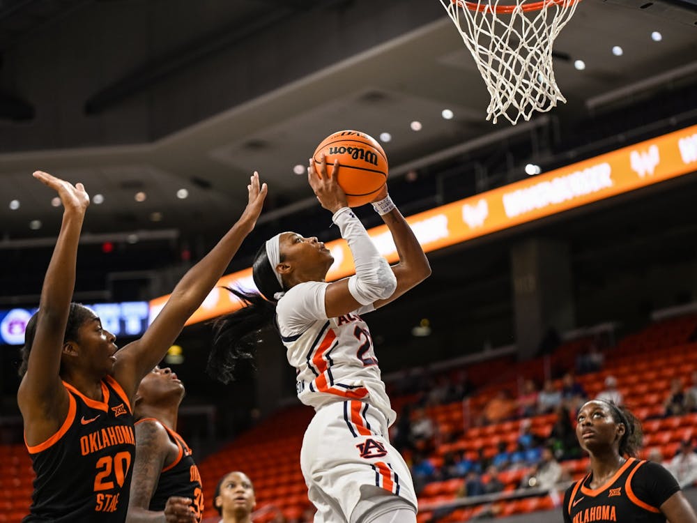 Dec 5, 2021; Auburn, AL, USA; Honesty Scott-Grayson (23) goes up for a last second lay up during the game between Auburn and Oklahoma State at Auburn Arena. Mandatory Credit: Grayson Belanger/AU Athletics