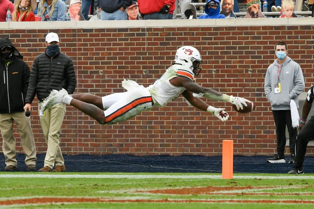 Oct 3, 2020; Oxford, MS, USA; Tank Bigsby (4) dives for the touchdown during the game between Auburn and Ole Miss at Vaught Hemingway Stadium. Mandatory Credit: Todd Van Emst/AU Athletics