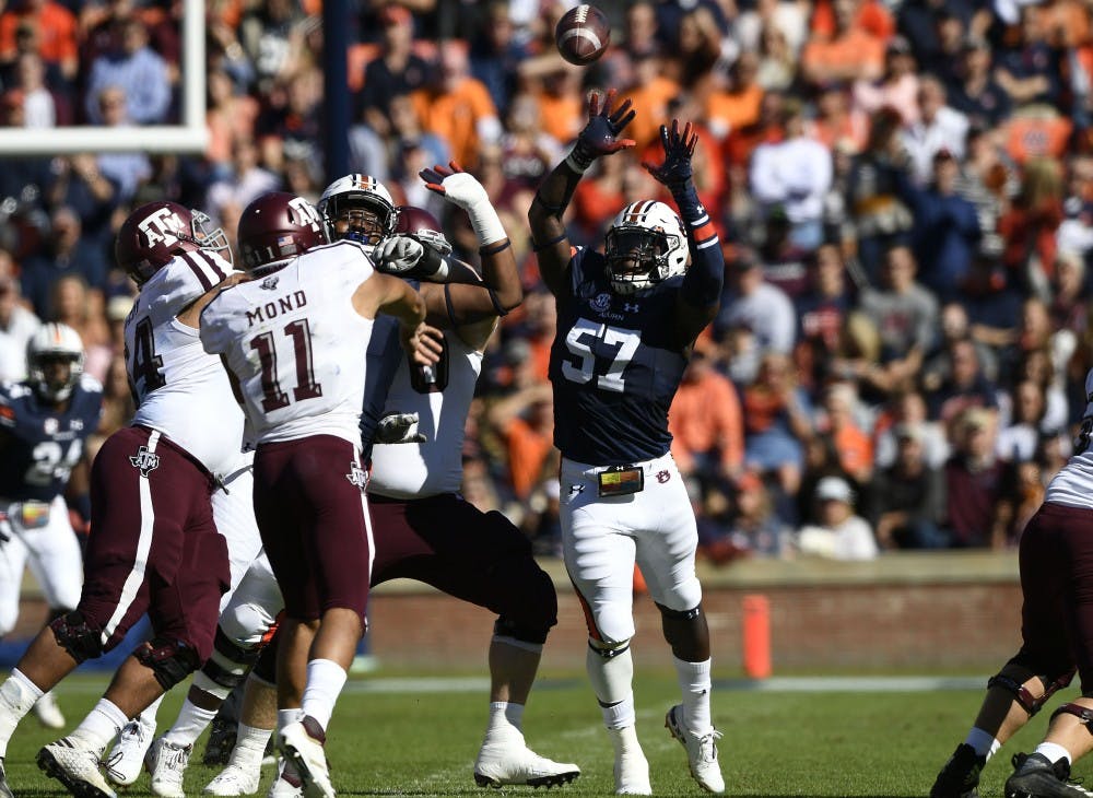 Auburn;s Deshaun Davis pressures A&M quarterback Mond Kellen into n incomplete pass in the first half.Texas A&M at Auburn football on Saturday, Nov 3, 2018 in Auburn, Ala.Todd Van Emst/AU Athletics 