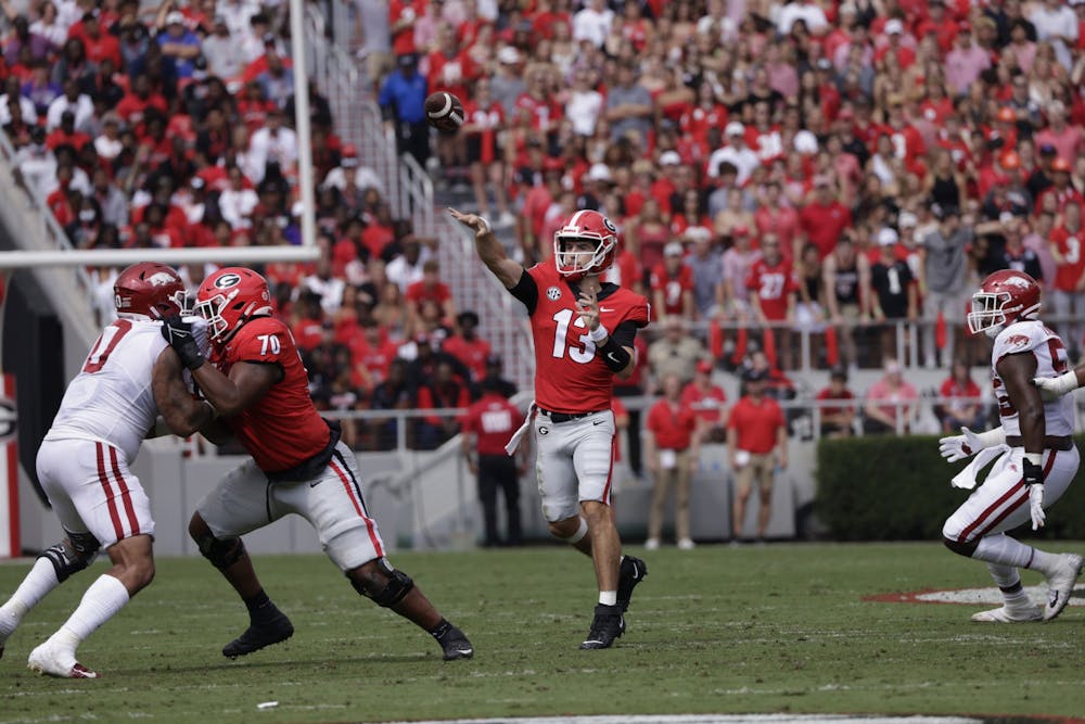 Georgia quarterback Stetson Bennett (13) during the Bulldogs’ game with Arkansas in Dooley Field at Sanford Stadium in Athens, Ga., on Saturday, Oct. 2, 2021. (Photo by Andrew Davis Tucker)