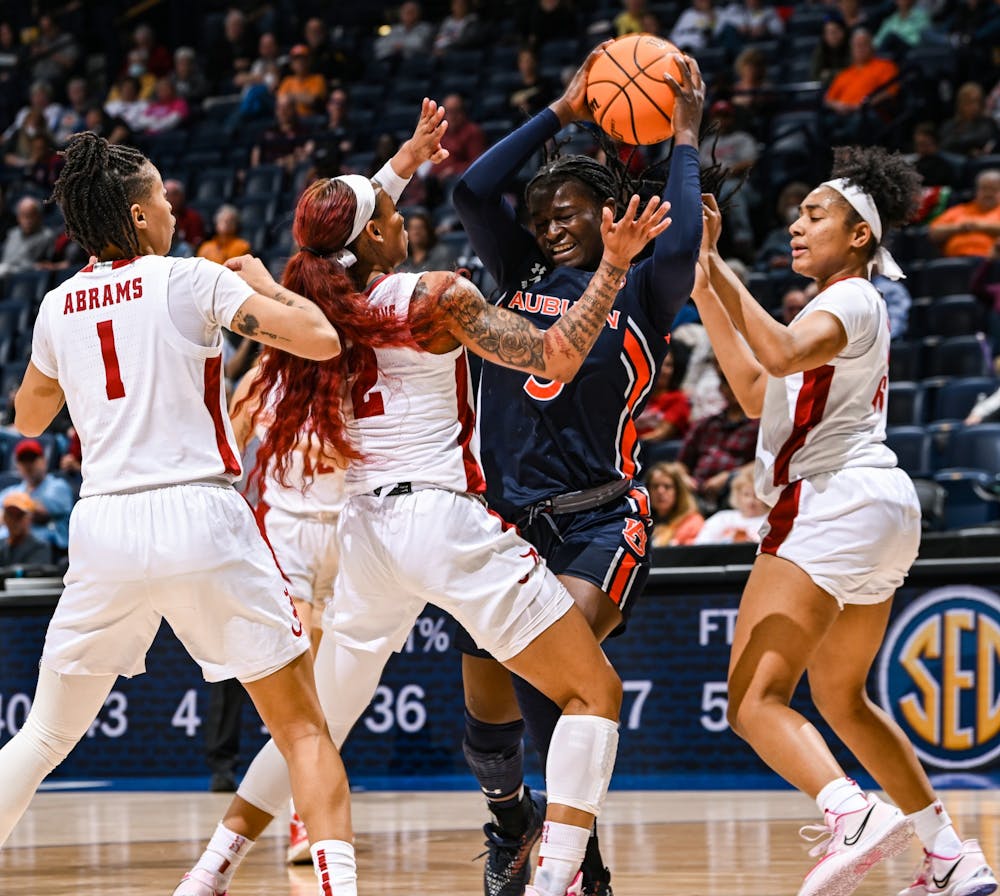Aicha Coulibaly (5) looks for a pass during the gameAuburn v AlabamaSEC Women’s Basketball Tournament on  Wednesday, March 2, 2022 in Nashville, TN.Todd Van Emst/SEC