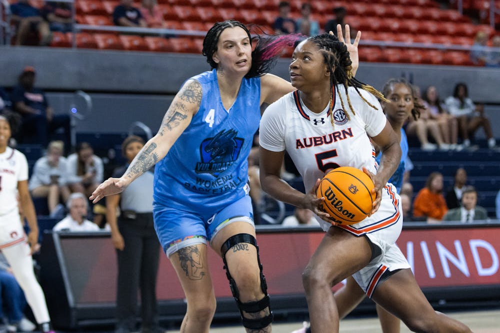 Auburn Women's Basketball forward DeYona Gaston sets up points for her team. 

Gracie Murray, The Auburn Plainsman