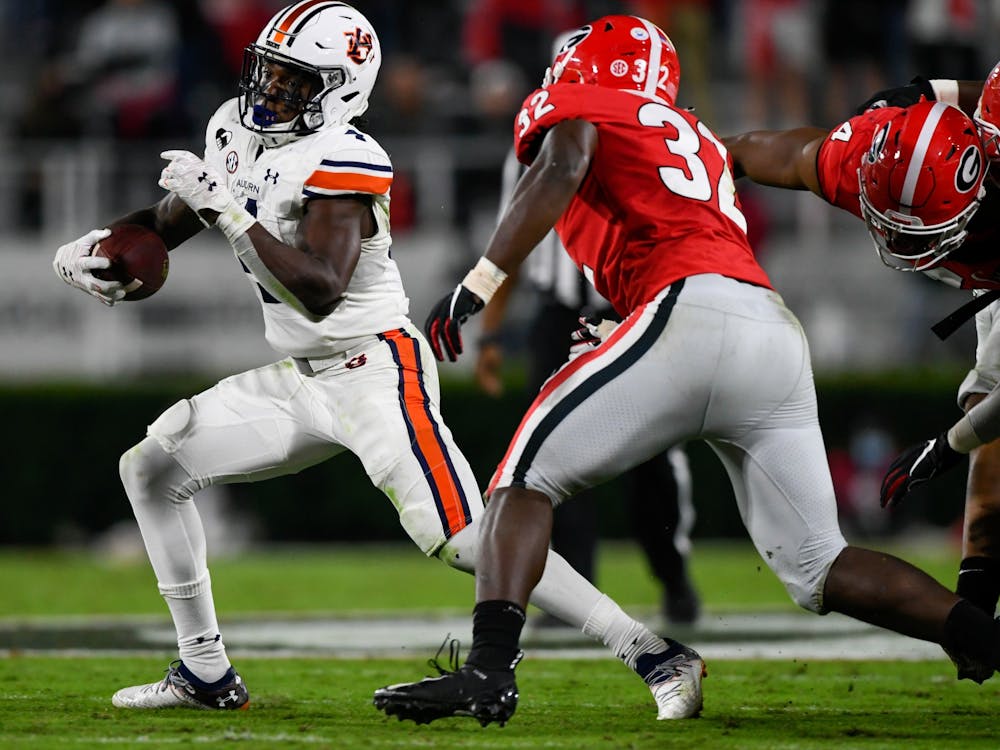 Oct 3, 2020; Athens, GA, USA; Tank Bigsby (4) rushes to the outside during the game between Auburn and Georgia at Samford Stadium. Mandatory Credit: Todd Van Emst/AU Athletics