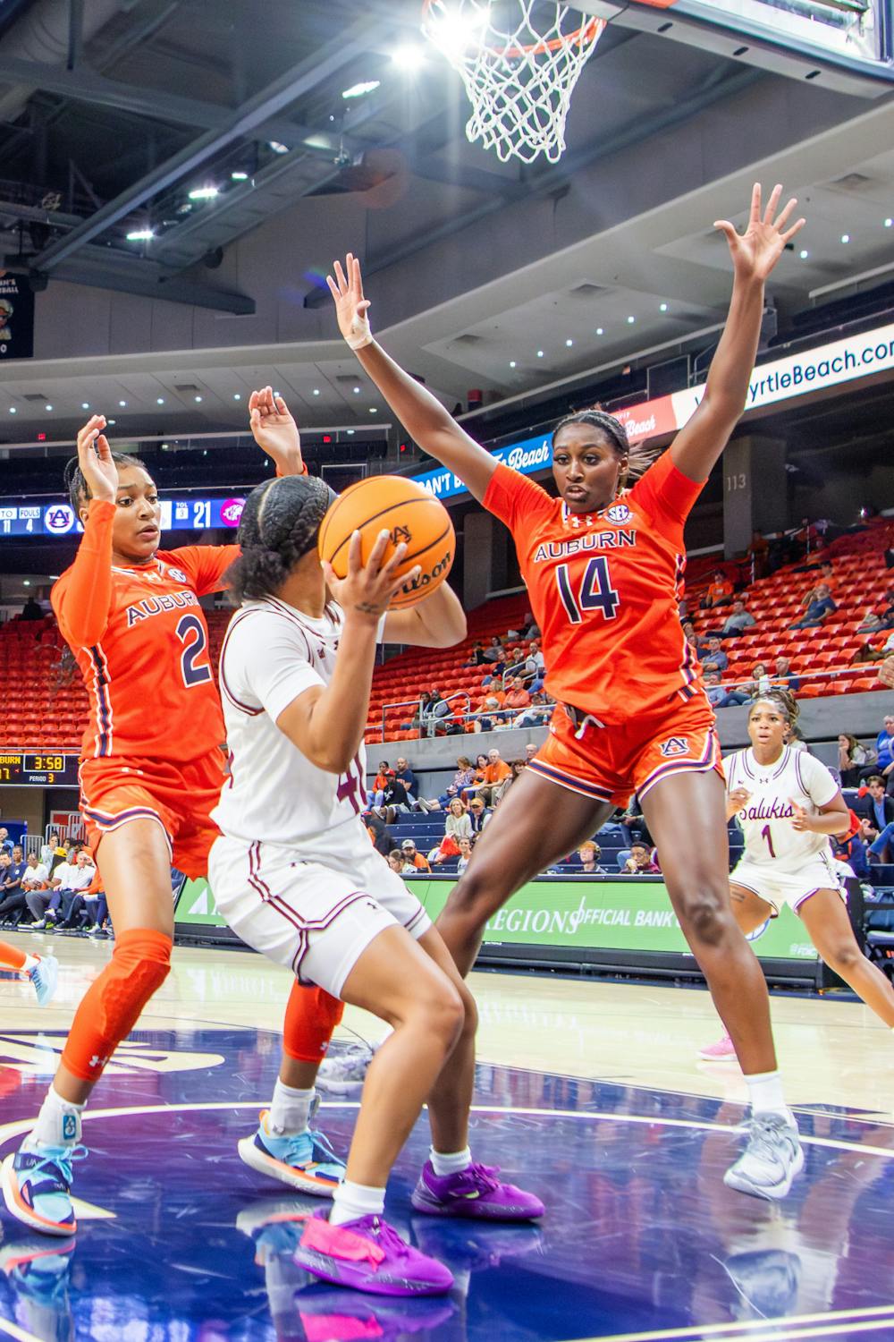 Taylen Collins (#14) and Jordan Hunter (#2) pressure an opponent in the paint in Neville Arena on Nov. 4th 2024.

Danny Zimmermann, The Auburn Plainsman