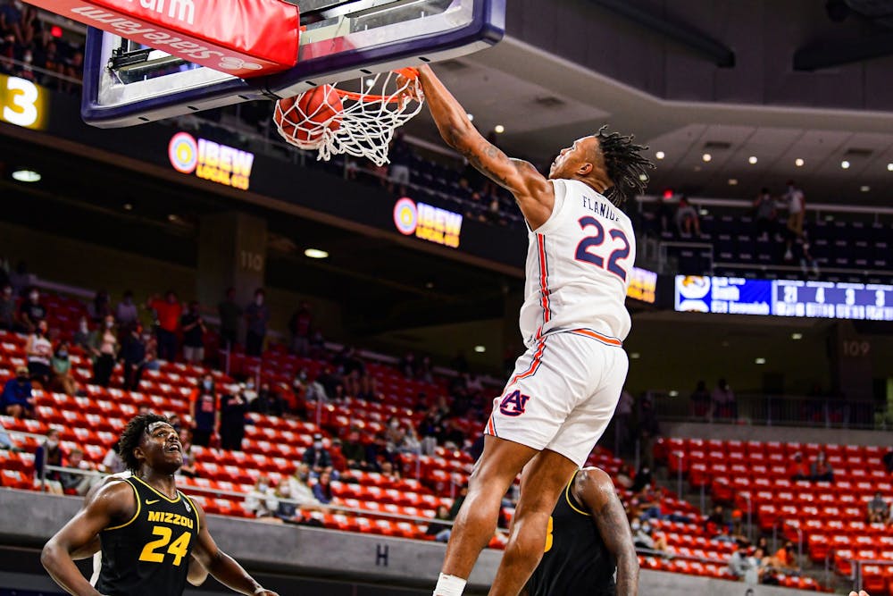 Jan 21, 2021; Auburn, AL, USA; Auburn Tigers guard Allen Flanigan (22) dunks the ball during the game between Auburn and Missouri at Auburn Arena. Mandatory Credit: Shanna Lockwood/AU Athletics