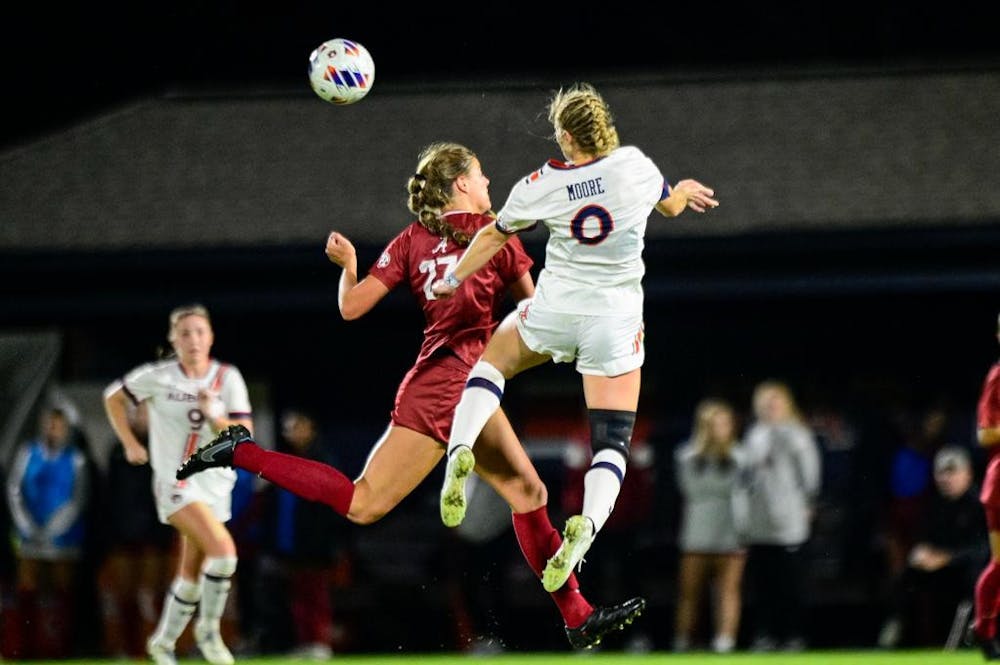 Oct 27, 2022; Auburn, Al, USA; Madeline Moore (0) goes up for a header during the game between Auburn and Alabama at Auburn Soccer Complex. Grayson Belanger/AU Athletics