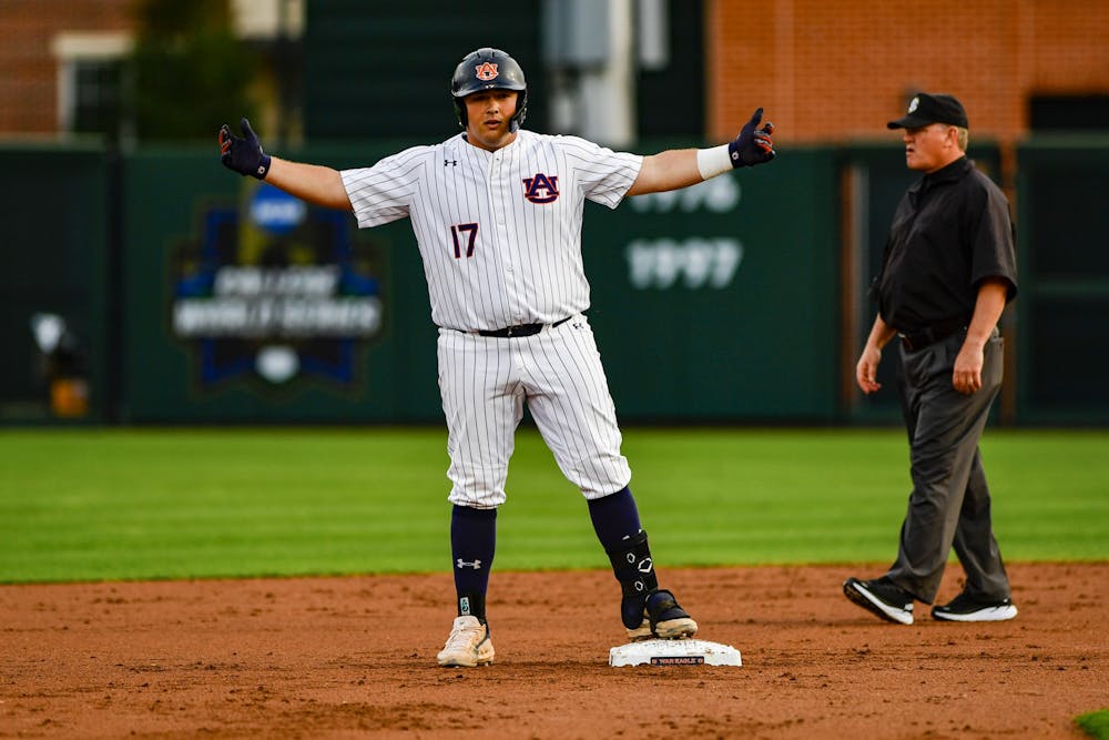 March 29, 2022; Auburn, AL, USA; Sonny DiChiara (17) reacts after getting to second during the game between Auburn and Jacksonville State at Plainsman Park. Mandatory Credit: Jacob Taylor/AU Athletics