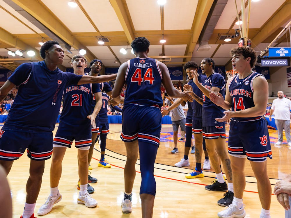 Dylan Cardwell walks onto the court during starting lineups prior to Auburn vs Iowa State on Nov. 25, 2024. Photo by Luca Flores | The Auburn Plainsman